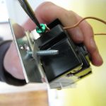 New dimmer switch in. Attaching the ground wire. 