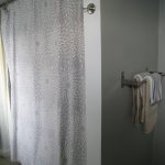 Bathroom shower curtain and hand towel rack. 