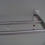 Towel rack in. Whoops, a couple of extra misplaced holes that need to be patched.