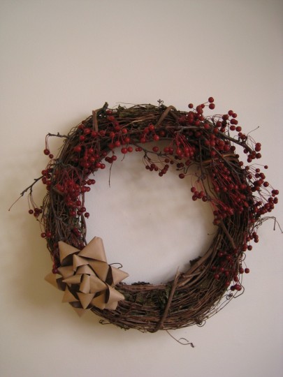 The finished wreath with real berries and handmade bow.