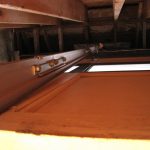 Can you see that tiny white trigger at the end of the metal guide? That's what the door was accidentally hitting, but really, is what the bottom of the door should have been hitting to trigger when it was all the way raised.