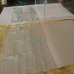 Assembled strips of glass and secured the layers together with silicone gel.