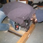 Attached legs to the "girders" which would support the tabletop. Attached legs to the "girders" which would support the tabletop.