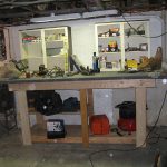 Luckily a couple shelves were lying around that fit perfectly on top of the bench, and there was a fluorescent light fixture I bolted up and plugged in for superior bench lighting. All I have to do now is start organizing.