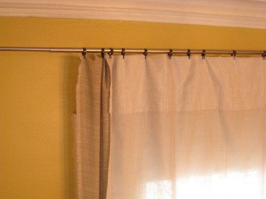 Living room curtain with a reused rod and some inexpensive hooks.