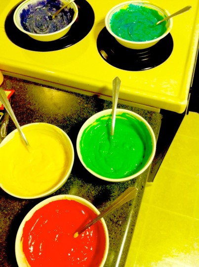 Mixing cupcake batter. With one... single... drop of potent food coloring.