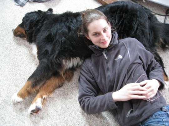 Hard to tire out the puppy. He's letting me relax on him?