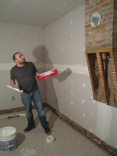 Taping and mudding post-drywalling.