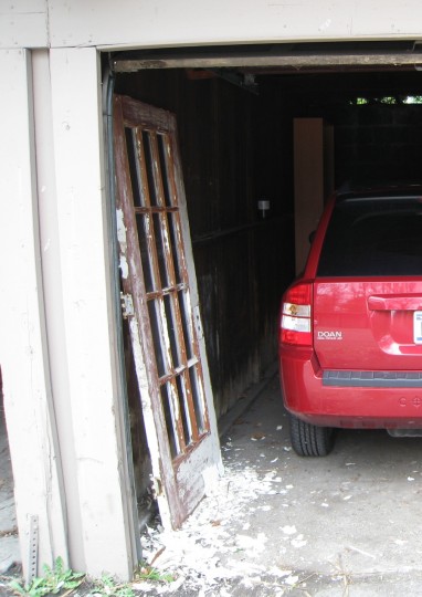New old door and Jeepster fighting for space in the apartment garage. Check out how much I had already removed and let fall to the ground in this photo. I'm so messy.