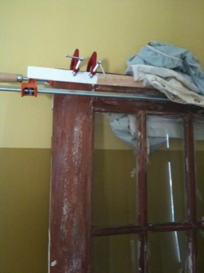 Gluing, clamping, and fixing the top of the door. This worked like a cast and we let it sit and dry for a full week before proceeding with installation. 