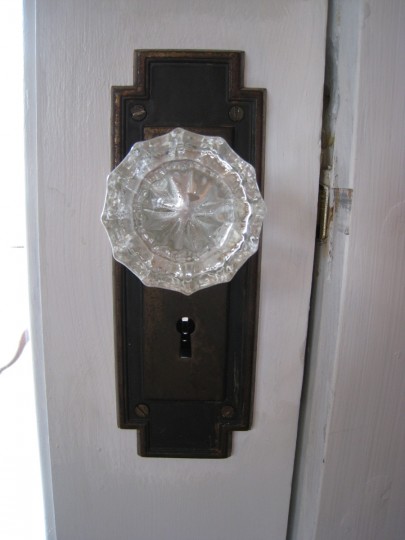 A lovely glass knob, borrowed from an upstairs closet door. I'd rather have it in a more visible place.