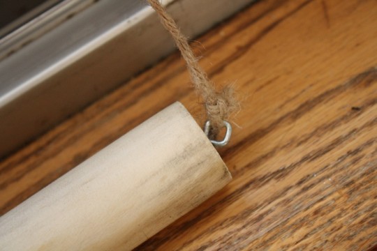 Eyelet hook in a dowel.
