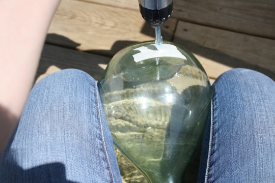 Holding the bottle between my knees. Future effected area, taped, I was ready to start.