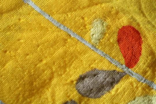 Beginning the Orla Kiely pattern on the yellow napkin canvas.