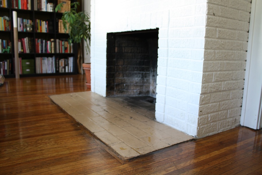 Painting an old fireplace hearth.