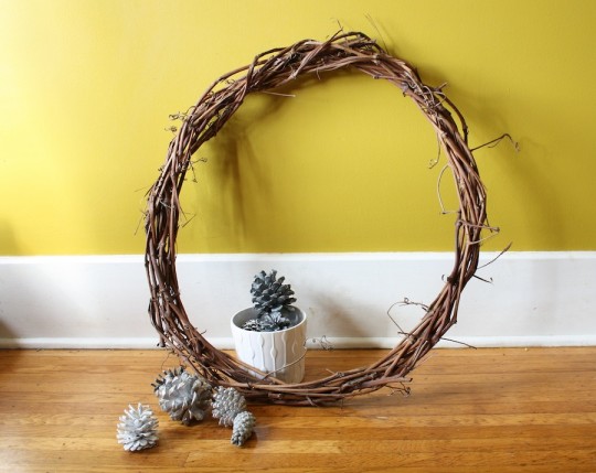 Painted pine cones and a handmade grape vine wreath.