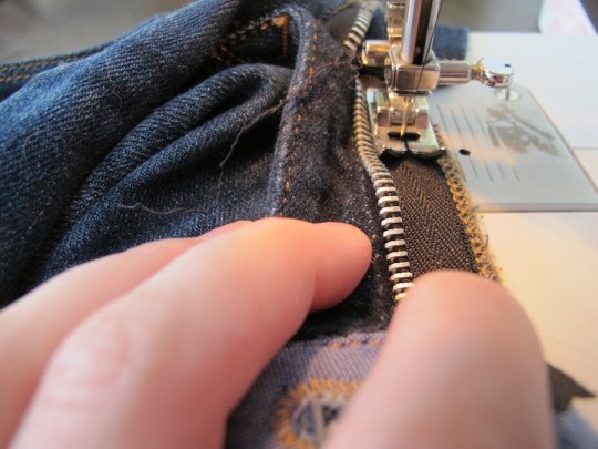 Sewing a new denim zipper.