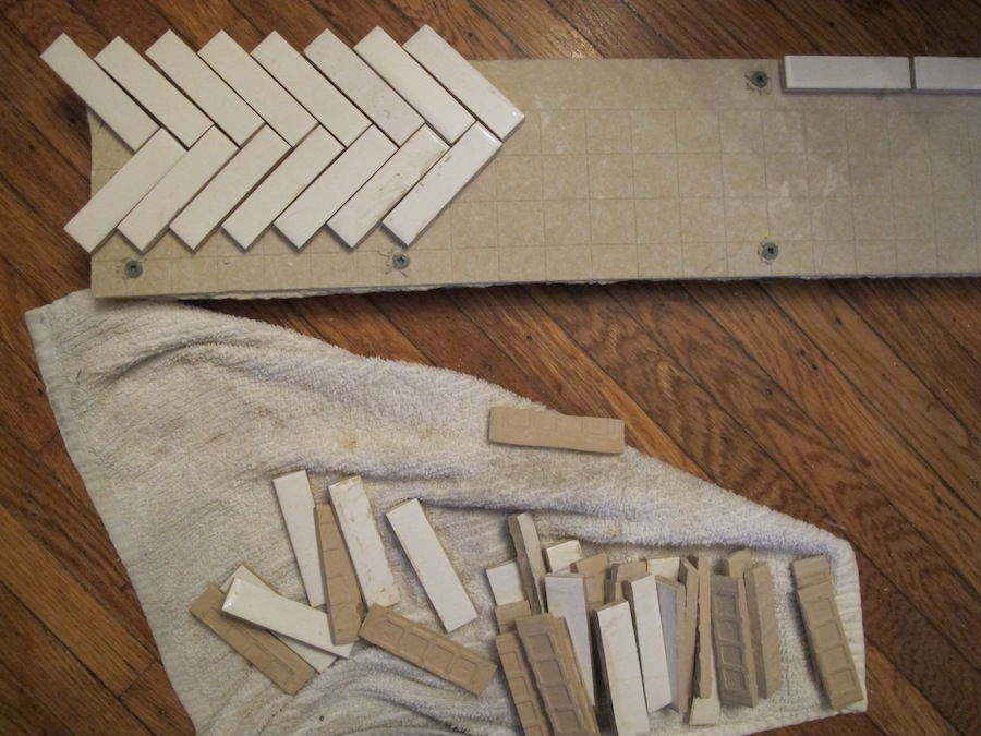 Dryfitting pieces of 3/4"x3" subway tile to the HardiBacker.