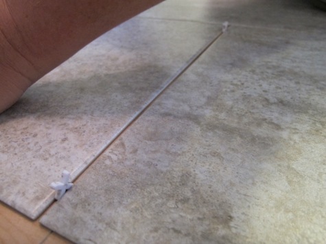 Using 1/8" spacers when installing groutable vinyl tiles.