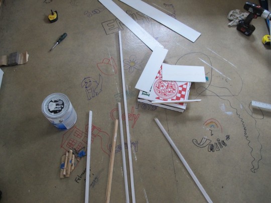 Painting baseboard and trim for the kitchen.