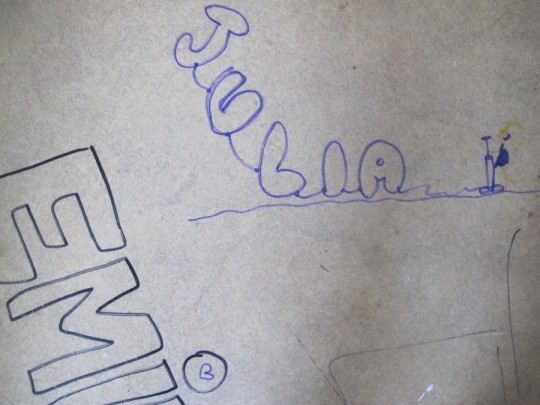 Coloring on the vinyl floor.