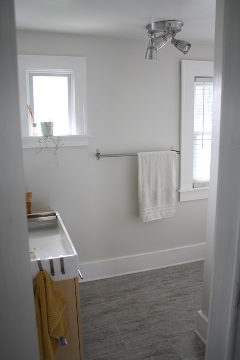 An updated bathroom with new window trim.