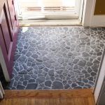 Finished entryway with a DIY stone floor.