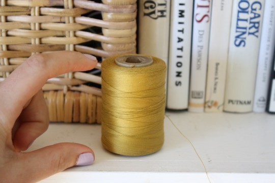 Sizable bolt of pretty golden thread.