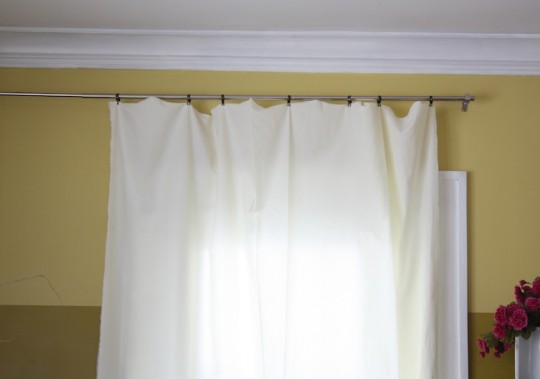 Simple curtain clips, bronze from Walmart.