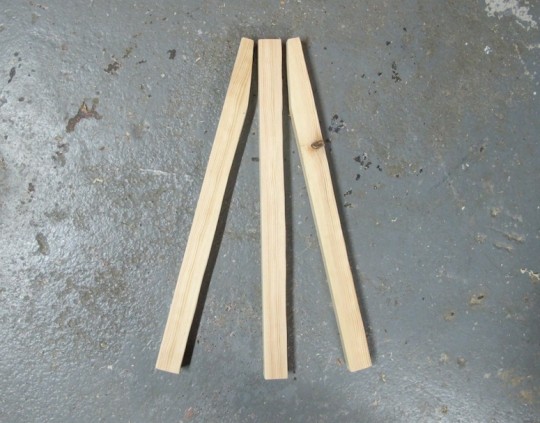 Trio of 14" pieces of wood. Future easel.