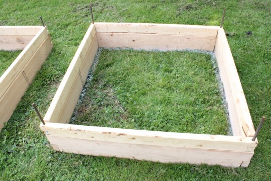 Spray painting along the inside of the planter boxes.