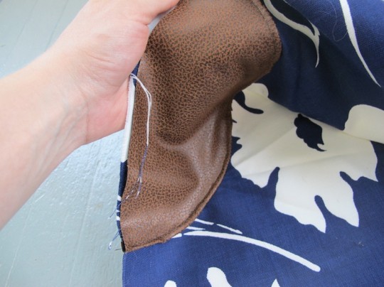 Sewing the bag "elbow patches" into place.