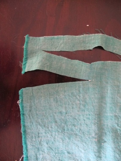 Cut the fabric so that it's creating one long single strand.