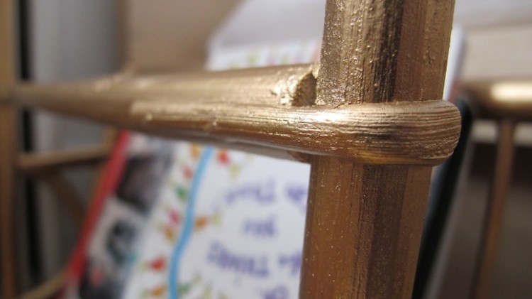 Bentwood magazine rack in gold.