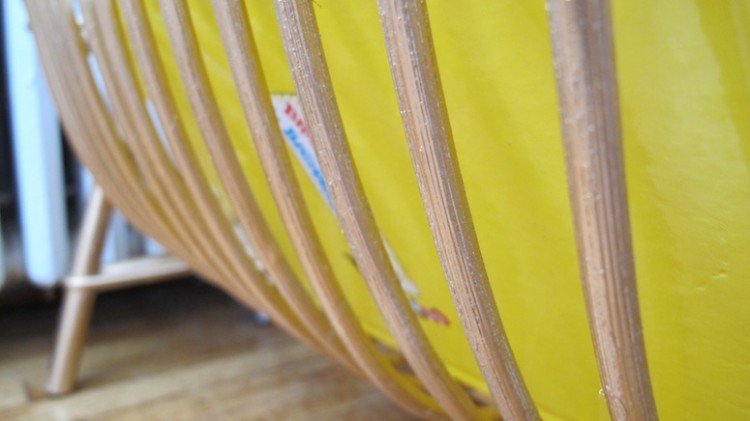 Bentwood magazine rack in gold.