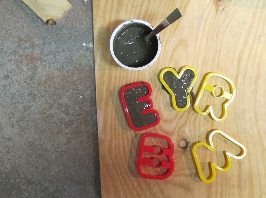 Crafty portland cement letters using cookie cutters.