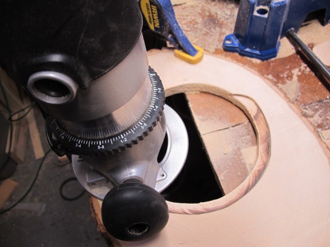 Routing a rabbet into the pre-cut circle, a place for the mirror to sit within.