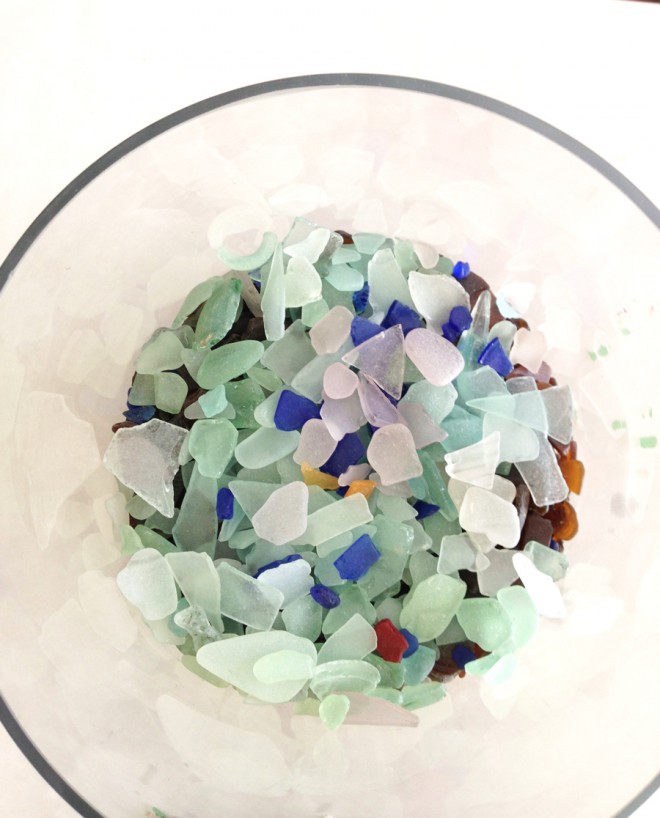 Sorting the beach glass into a vase by color.