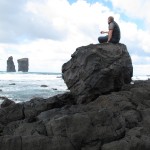 Watching the ocean on a big piece of lava rock.