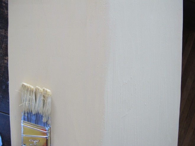 Painting the wooden shelf with chalk paint.