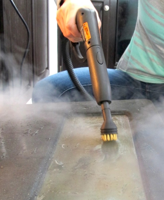 The HomeRight SteamMachine cleaning the inside of my oven.