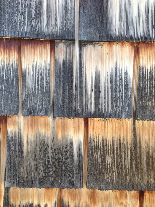 Faux weathered treatment on cedar shingles on the Boldt Boat House, Thousand Islands, NY.