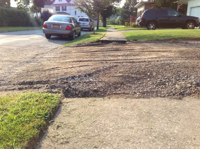 Smoothing out the entry for the driveway.