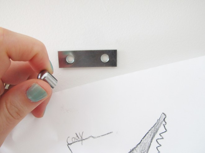Hanging images in a gallery wall using magnets.