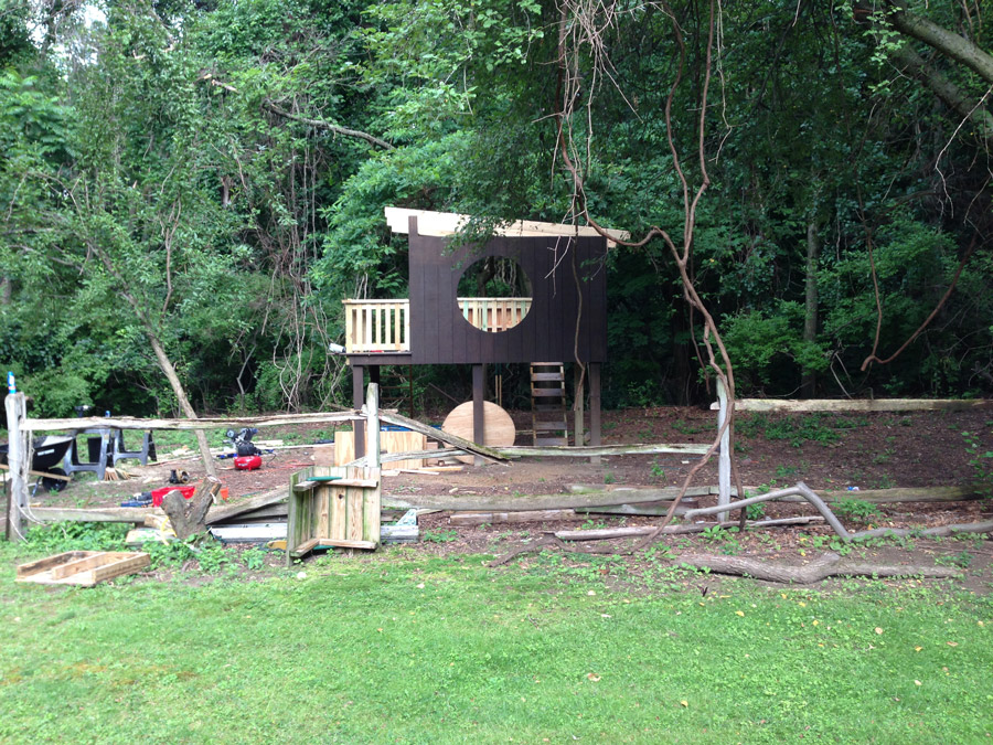 Our modern treehouse, with the raw wood railing.