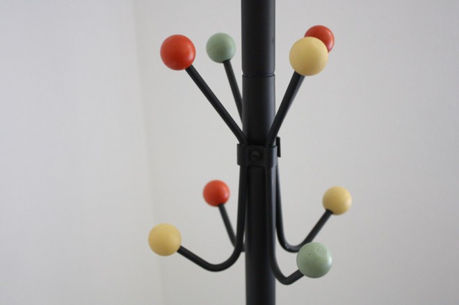 Eames-inspired coat rack with round beads.