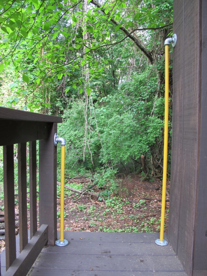 Handrails in the treehouse for ladder safety.
