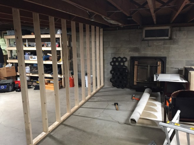 Building walls in a basement art room.