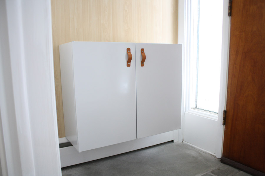 White floating cabinet using upcycled metal kitchen cabinets.