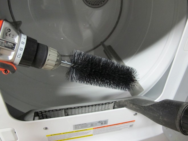 Clean the vent with the small bristled brush and a drill.
